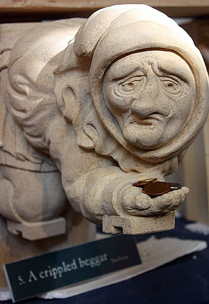 A crippled beggar, York Minster, England