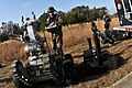 "Defense.gov_News_Photo_110224-N-YR391-002_-_Chief_Petty_Officer_Rich_Mcave_assigned_to_Explosive_Ordnance_Disposal_Mobile_Unit_6_operates_a_Talon_robot_and_a_Remote_Ordnance_Neutralization.jpg" by User:Slick-o-bot