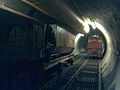 "Tunnel_train_track_crossing.jpg" by User:Saracen1608