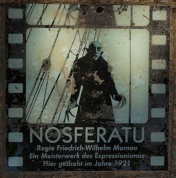 Commemorative plaque for the silent motion picture classic Nosferatu (1922) near the entrance gate of the Holy Spirit Churchyard in Wismar, by J.-H. Janßen
