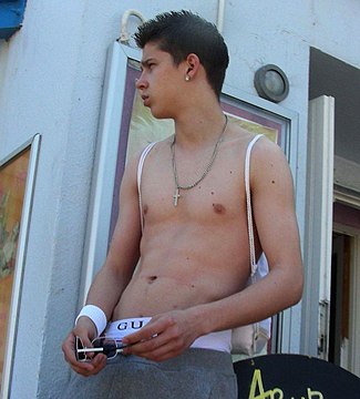 "Summer_2009_male_shirtless_earring.jpg" by User:File Upload Bot (Magnus Manske)
