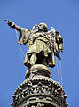 Two workers cleaning the Monument to Columbus, sculpture by Rafael Atché i Ferré, 1888, Catalunya. Detail of the monument designed by the architect Gaietà Buigas