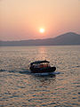 "Sampan_under_sunset_Hong_Kong.jpg" by User:AC Studio